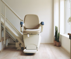 Stairlift chair installed beside a staircase