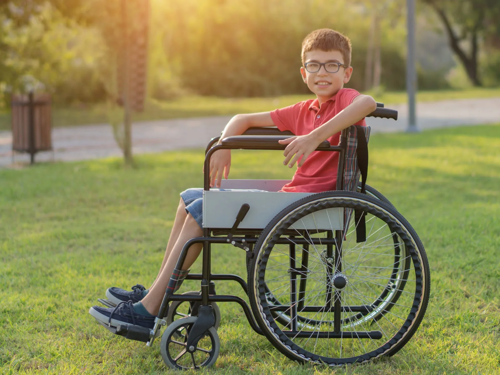 A young wheelchair user enjoying a park